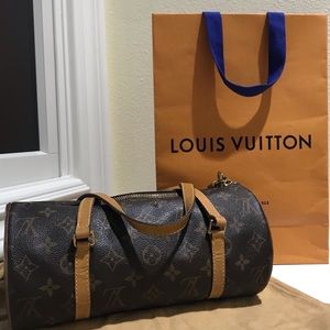 Louis Vuitton round cylinder wristlet purse